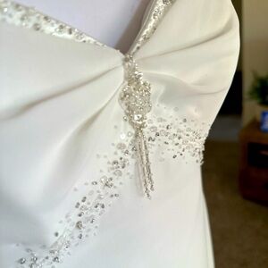 Elegant Crystal beaded wedding dress design by Maggie Sottero.